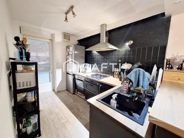 Immeuble de rapport comportant un local commercial et appartement T4