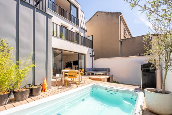 Maison d’architecte avec terrasses et couloir de nage