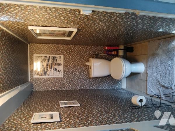 UNE MAISON D'HABITATION dans village calme