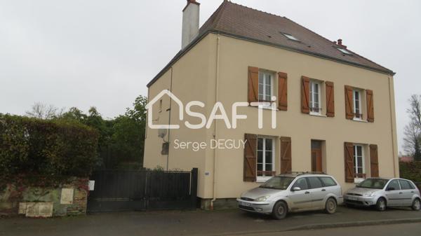 MAISON FAMILIALE avec dépendances édifiée sur un terrain arboré