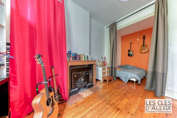 T2 bis 45,67 m² traversant / Garage box / Rez-de-jardin