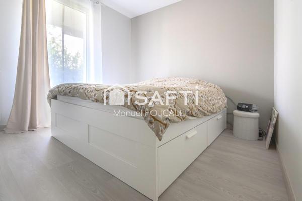 Appartement 3 pièces de 61 m2 en rez de jardin avec sa terrasse de 22 m2, son jardin de 100 m2 et son garage fermé