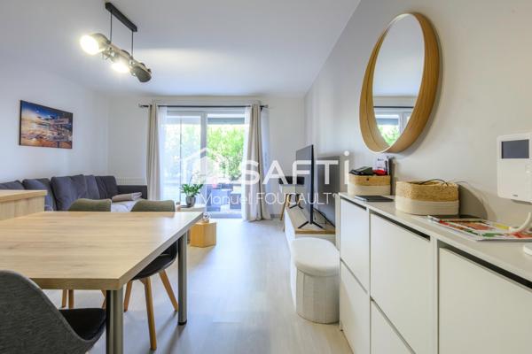 Appartement 3 pièces de 61 m2 en rez de jardin avec sa terrasse de 22 m2, son jardin de 100 m2 et son garage fermé