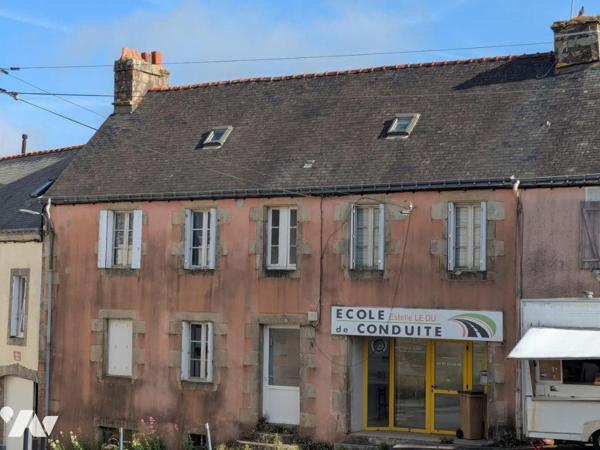IMMEUBLE A USAGE D'HABITATION ET DE COMMERCE