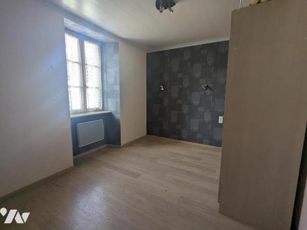 IMMEUBLE A USAGE D'HABITATION ET DE COMMERCE