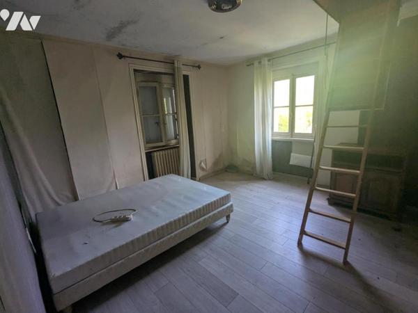 IMMEUBLE A USAGE D'HABITATION ET DE COMMERCE
