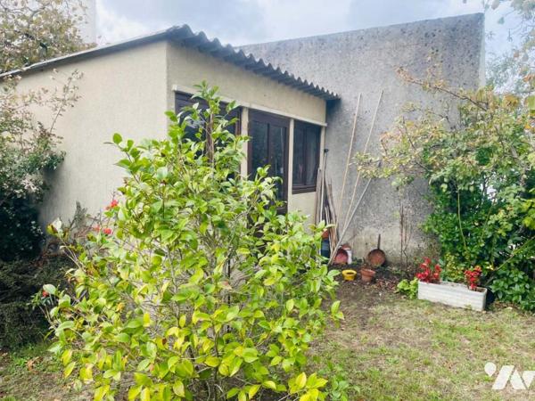 Maison avec jardin et garage 