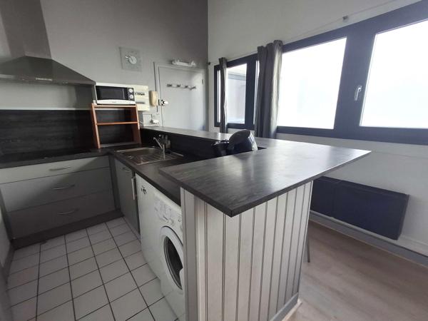 IMMEUBLE AVEC RAPPORT LOCATIF - LOCAL PROFESSIONNEL ET 2 APPARTEMENTS