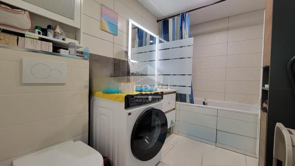 Appartement 2 chambres + garage + places de parking