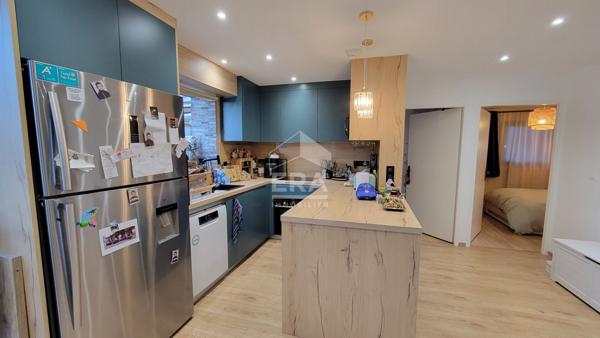 Appartement 2 chambres + garage + places de parking