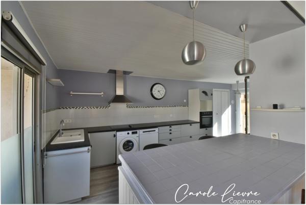 Immeuble avec local commercial et grand appartement sur LEZIGNAN LA CEBE