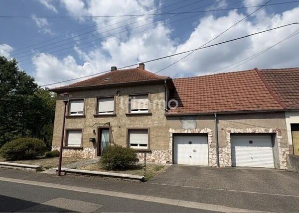 Maison semi mitoyenne côté garage