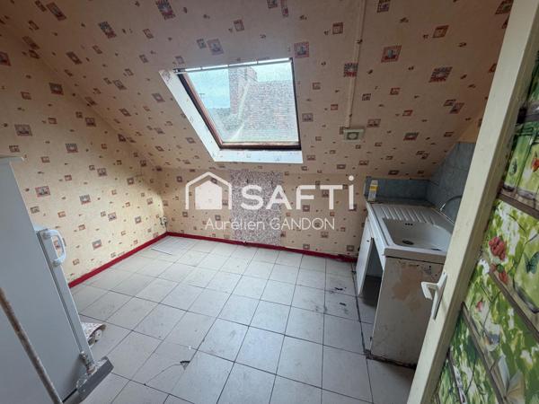 Immeuble avec 2 appartement et 1 local commercial