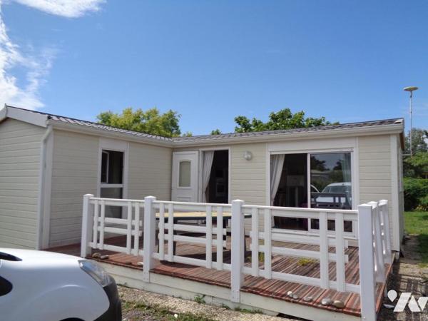 Chalet en ossature bois de 36,40 sur terrain 416 m² à 500 m de la plage. TRES RARE.