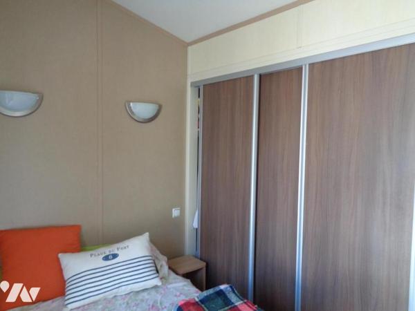 Chalet en ossature bois de 36,40 sur terrain 416 m² à 500 m de la plage. TRES RARE.