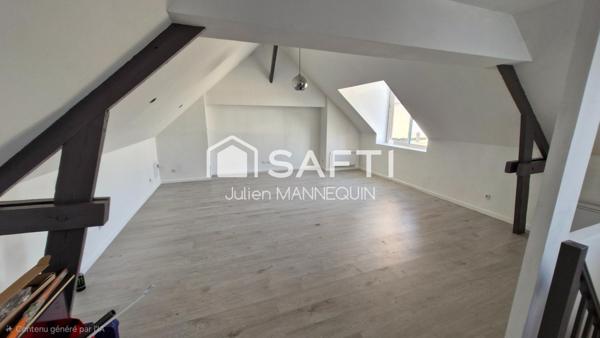 maison mitoyenne de 100 m2 , 2 chambres dont une suite parentale avec sa douche, cuisine ouverte sur le salon et accès a une terrasse