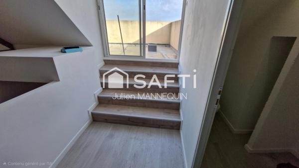 maison mitoyenne de 100 m2 , 2 chambres dont une suite parentale avec sa douche, cuisine ouverte sur le salon et accès a une terrasse