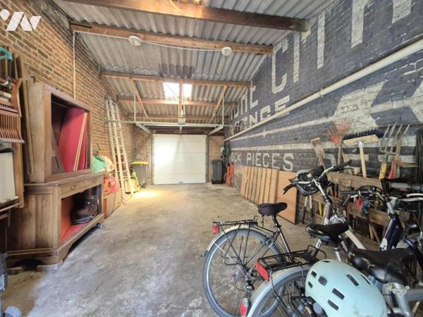 Maison bourgeoise avec jardin et grand garage – un bien rare en centre-ville