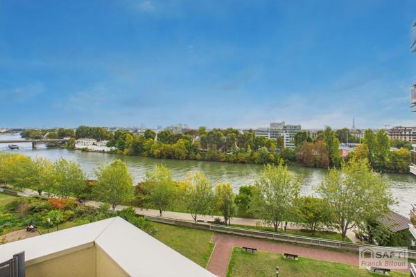 Vue SEINE, ÎLE DE LA JATTE et TOUR EIFFEL. Balcon, cave et parking.