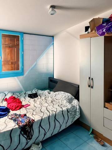 Maison bourbon bois à rénover de 97 m² avec mezzanine sur terrain de 343m2 – Enorme potentiel – Idéale famille nombreuse dans quartier paisible LA POSSESSION