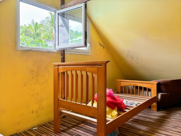 Maison bourbon bois à rénover de 97 m² avec mezzanine sur terrain de 343m2 – Enorme potentiel – Idéale famille nombreuse dans quartier paisible LA POSSESSION