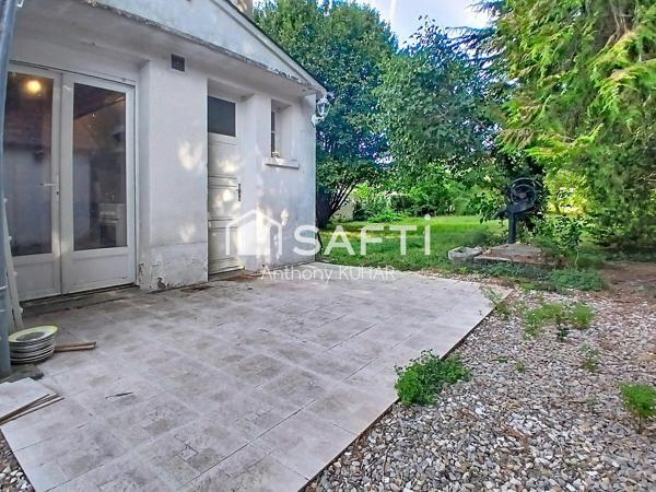 Charmante maison avec terrain arboré, garage et dépendance