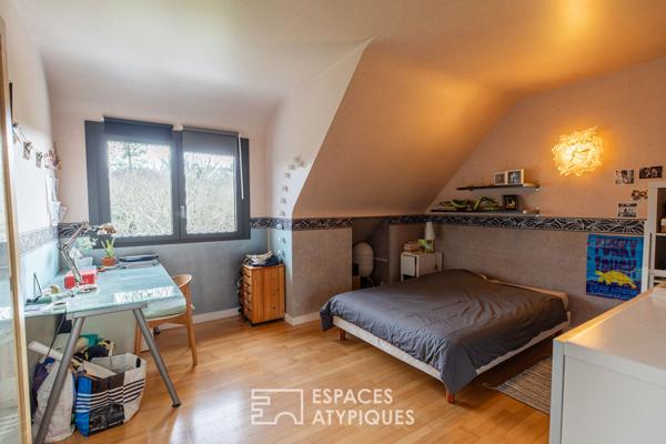 Maison familiale avec jardin d’hiver et jardin arboré