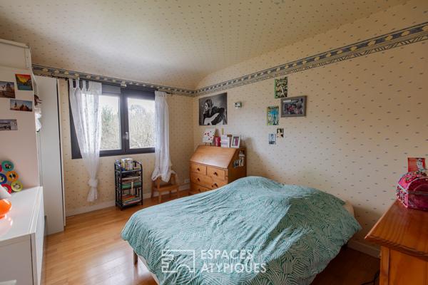 Maison familiale avec jardin d’hiver et jardin arboré