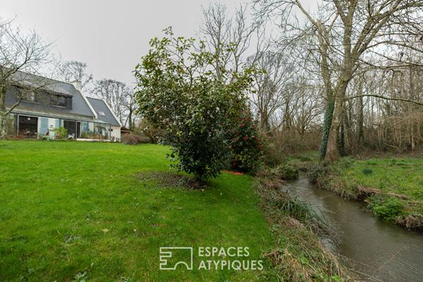 Maison familiale avec jardin d’hiver et jardin arboré