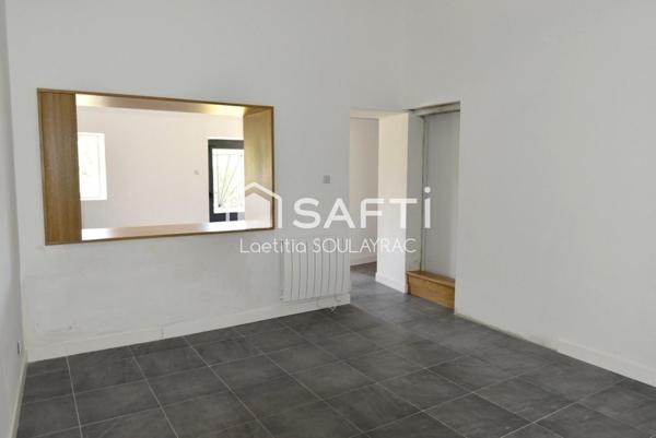 Maison de village rénovée de 108m² avec garage et jardin.