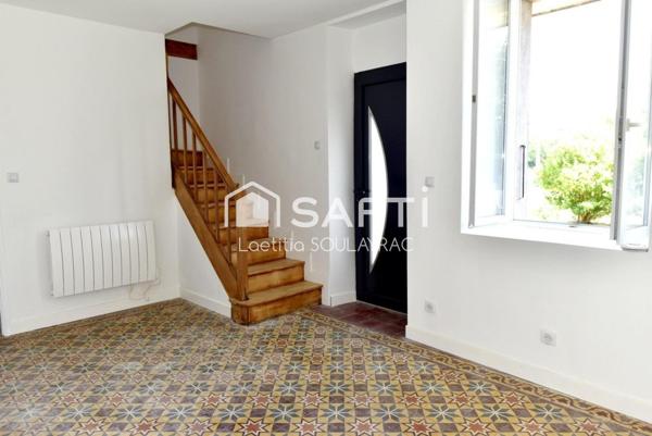 Maison de village rénovée de 108m² avec garage et jardin.