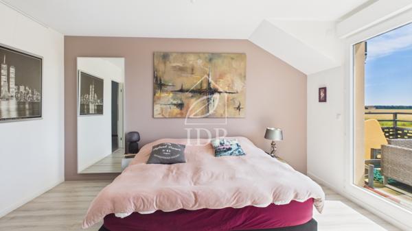 Grand T4 avec terrasse de 32 m² et balcon – 2 parkings en sous-sol