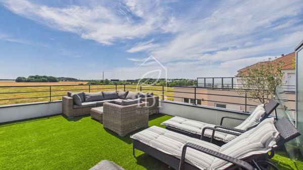 Grand T4 avec terrasse de 32 m² et balcon – 2 parkings en sous-sol