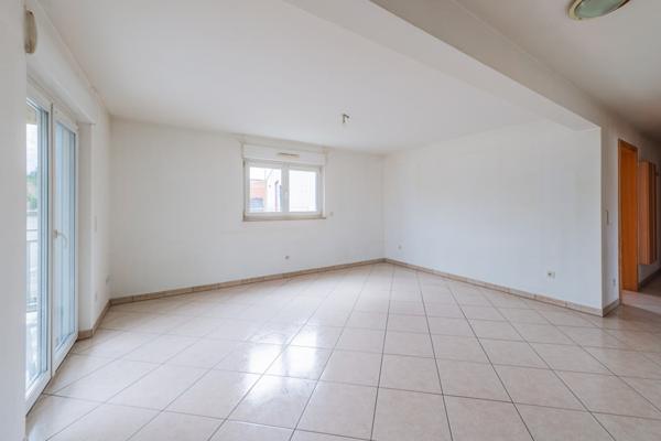 Appartement 3 pièces 75m², avec parking et garage double.