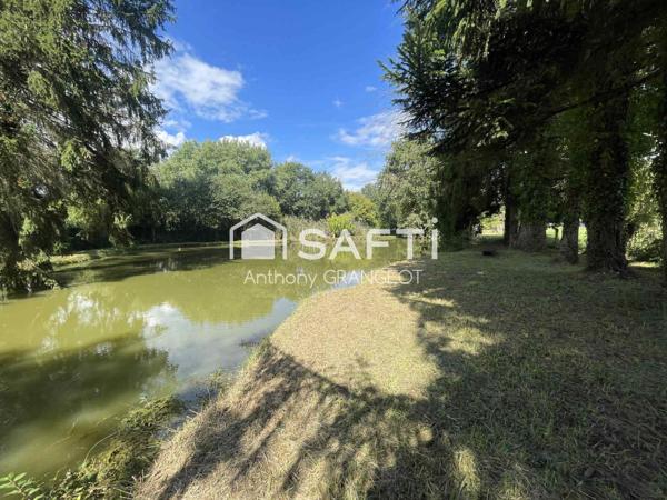 SUPERBE ETANG AVEC GRAND TERRAIN