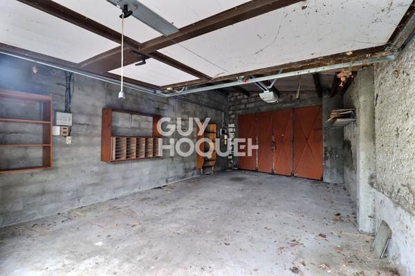 Parcelle de terrain avec garages et atelier