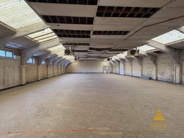 RARE – Ensemble professionnel 750 m² | Plein centre de Caudry | Parking privé clôturé ~100 véhicules