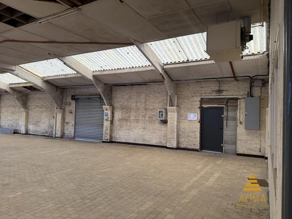 RARE – Ensemble professionnel 750 m² | Plein centre de Caudry | Parking privé clôturé ~100 véhicules