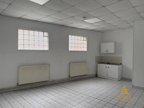 RARE – Ensemble professionnel 750 m² | Plein centre de Caudry | Parking privé clôturé ~100 véhicules