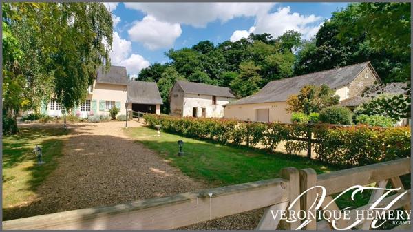 Cadre paisible pour cette propriété située en bord de rivière avec potentiel remarquable de gîte ou autre