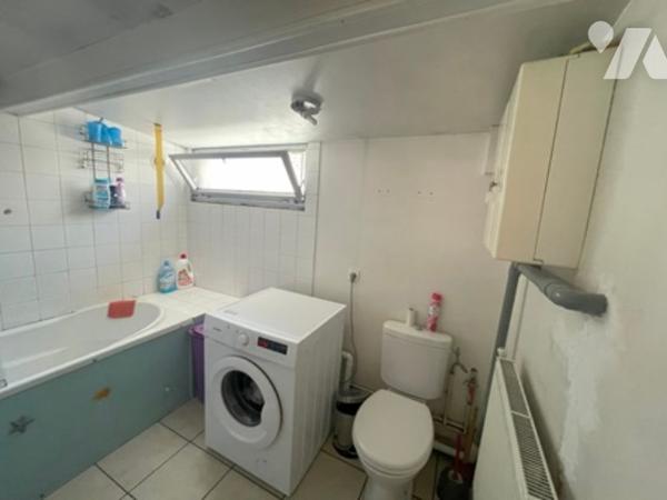 UNE MAISON A USAGE D'HABITATION