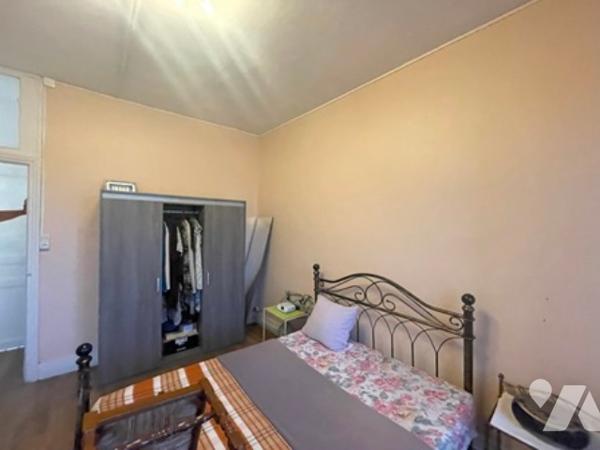 UNE MAISON A USAGE D'HABITATION