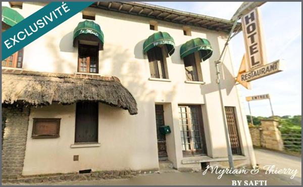 Immeuble 550 m², 10 chambres, salles de réception, bar, cuisine, grange, parking