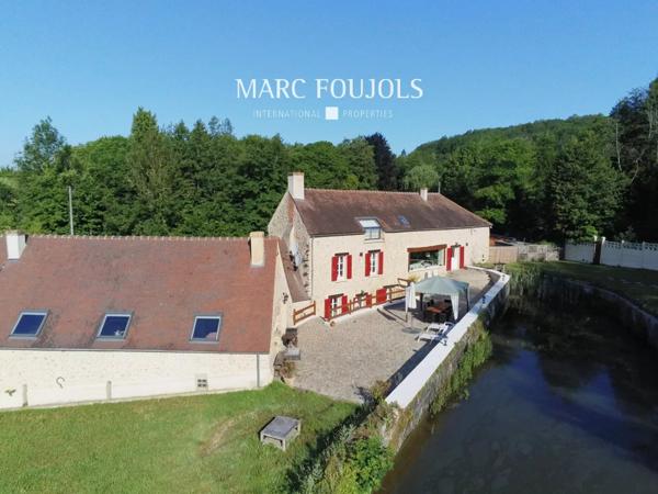 Moulin du XVIII rénové avec dépendance sur un parc de 13920m2
