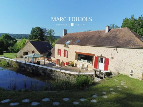 Moulin du XVIII rénové avec dépendance sur un parc de 13920m2