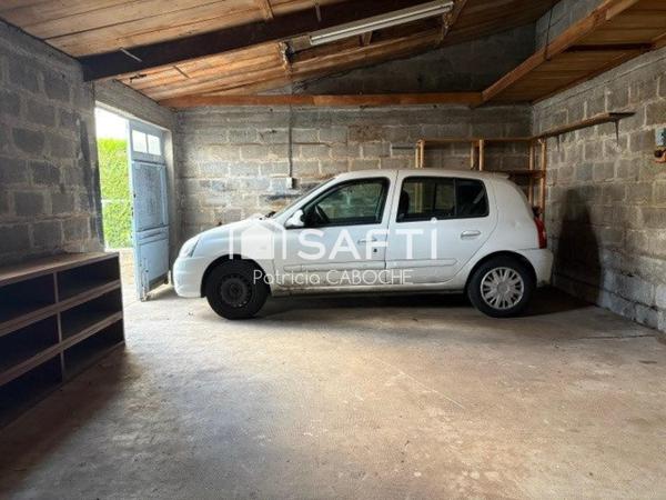 Parcelle 300 m2, maison de plain pied de 70 m2 avec grand garage à rénover