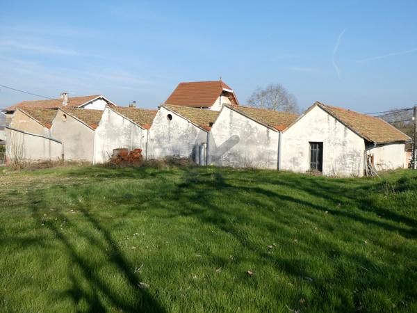 Ancienne usine de tissage avec habitation et terrain constructible