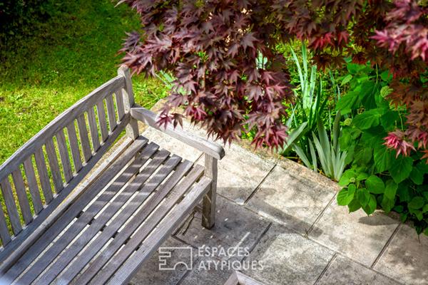 Maison de caractère abritée au coeur d’un jardin paysager d’exception