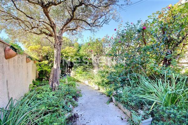 Marignane- Appartement 3/4 pièces d'une surface de 78 m² avec une véranda et un jardin.