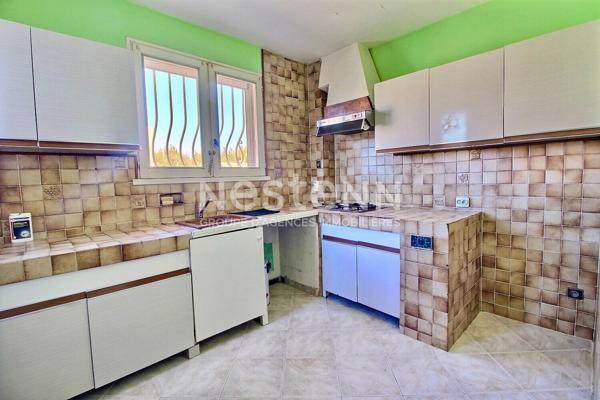 Marignane- Appartement 3/4 pièces d'une surface de 78 m² avec une véranda et un jardin.